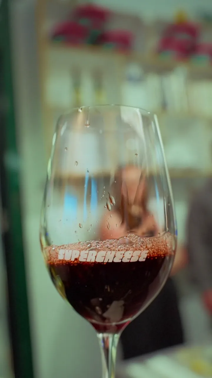 Red wine poured into a Supercheese glass, from our Supercheese video